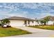 Single-story home with attached garage and landscaped yard at 1612 Nuremberg Blvd, Punta Gorda, FL 33983