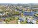 Bird's-eye view of canal-front home and neighborhood at 18138 Eau Gallie Cir, Port Charlotte, FL 33948