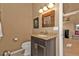 Guest bathroom with granite vanity and a toilet at 18138 Eau Gallie Cir, Port Charlotte, FL 33948