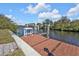 Private boat lift dock perfect for water access at 18138 Eau Gallie Cir, Port Charlotte, FL 33948