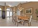 Elegant dining room with a large table and chandelier at 18138 Eau Gallie Cir, Port Charlotte, FL 33948