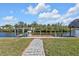 Private dock with seating area overlooking a peaceful canal at 18138 Eau Gallie Cir, Port Charlotte, FL 33948