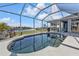 Enjoy this refreshing pool with a screened enclosure and expansive water views at 18138 Eau Gallie Cir, Port Charlotte, FL 33948