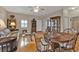 Bright dining area with hardwood floors, a wooden table, and a view into the living room at 2110 Royal Tern Cir, Punta Gorda, FL 33983