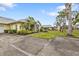 House exterior showcasing a driveway and nicely landscaped surroundings at 2110 Royal Tern Cir, Punta Gorda, FL 33983