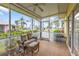 Relaxing screened porch with seating and ceiling fan at 2110 Royal Tern Cir, Punta Gorda, FL 33983