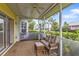 Screened porch with seating and view of backyard at 2110 Royal Tern Cir, Punta Gorda, FL 33983