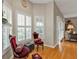 Sunlit sitting area, featuring two chairs and hardwood floors at 2110 Royal Tern Cir, Punta Gorda, FL 33983