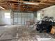 Unfinished garage with overhead door and workbench at 2115 Myrtle Ave, Punta Gorda, FL 33950