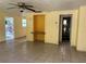 Spacious living room featuring a built-in wood counter and painted accent wall at 2115 Myrtle Ave, Punta Gorda, FL 33950