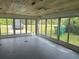 Sunroom with glass walls, wood ceiling, and view of the backyard at 2115 Myrtle Ave, Punta Gorda, FL 33950