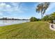 Landscaped backyard with lake access at 22259 Priscilla Ave, Port Charlotte, FL 33954