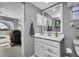 Bright bathroom with white vanity and mirror at 22259 Priscilla Ave, Port Charlotte, FL 33954