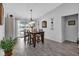 Dining room with a wooden table, six chairs, and view of the pool at 22259 Priscilla Ave, Port Charlotte, FL 33954