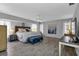 Large main bedroom with gray wood-look floors and plenty of natural light at 22259 Priscilla Ave, Port Charlotte, FL 33954