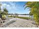 Spacious patio with lake view and lounge chairs at 22259 Priscilla Ave, Port Charlotte, FL 33954