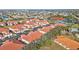 Aerial view of a community with townhouses, tennis courts, and a pool at 240 W End Dr # 412, Punta Gorda, FL 33950