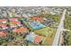 Aerial view of community with tennis courts, pool, and lush landscaping at 240 W End Dr # 412, Punta Gorda, FL 33950