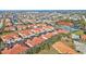 Aerial view of community, featuring resort-style pool, tennis courts, and waterfront access at 240 W End Dr # 412, Punta Gorda, FL 33950