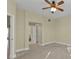 Bedroom with access to bathroom and ceiling fan at 240 W End Dr # 412, Punta Gorda, FL 33950