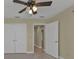 Bright bedroom with double doors and access to hallway at 240 W End Dr # 412, Punta Gorda, FL 33950