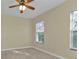 Well-lit bedroom with ceiling fan and neutral decor at 240 W End Dr # 412, Punta Gorda, FL 33950