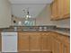 Kitchen boasts granite countertops and light wood cabinets at 240 W End Dr # 412, Punta Gorda, FL 33950