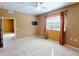 Spacious bedroom with carpeted floor, ceiling fan, and large window at 24067 Park Place S Dr # 71, Punta Gorda, FL 33980