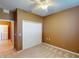 Spacious bedroom with double-door closet and ceiling fan at 24067 Park Place S Dr # 71, Port Charlotte, FL 33980