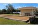 Community bocce ball court with a covered seating area at 24067 Park Place S Dr # 71, Port Charlotte, FL 33980