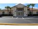 Community clubhouse with parking lot and landscaping at 24067 Park Place S Dr # 71, Punta Gorda, FL 33980