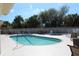 Relaxing community pool and spa with surrounding patio furniture at 24067 Park Place S Dr # 71, Port Charlotte, FL 33980