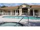 Community pool and spa with a view of the clubhouse at 24067 Park Place S Dr # 71, Punta Gorda, FL 33980