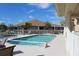 Community pool with lounge chairs and surrounding building at 24067 Park Place S Dr # 71, Port Charlotte, FL 33980