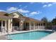 Community pool area with adjacent building and lounge chairs at 24067 Park Place S Dr # 71, Port Charlotte, FL 33980