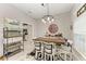 Rustic breakfast nook with a wooden table, pendant lighting, and open shelving at 2467 Odessa Ln, Punta Gorda, FL 33983