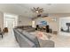 Living room with sectional sofa, farmhouse decor, and large TV at 2467 Odessa Ln, Punta Gorda, FL 33983