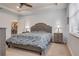 Main bedroom with cozy bed, nightstands and view of kitchen at 2529 Sherman Oak Dr, North Port, FL 34289