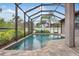 Inviting screened pool with tiled coping and spacious deck at 2529 Sherman Oak Dr, North Port, FL 34289