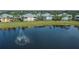 Aerial view of waterfront property, showcasing community and lake at 25533 Heritage Lake Blvd # 19, Punta Gorda, FL 33983