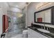 Modern bathroom with a glass-enclosed shower and granite vanity at 25533 Heritage Lake Blvd # 19, Punta Gorda, FL 33983