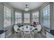 Charming breakfast nook with white wicker chairs and a glass table at 25533 Heritage Lake Blvd # 19, Punta Gorda, FL 33983
