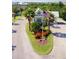 Attractive community entrance with landscaping and flag at 25533 Heritage Lake Blvd # 19, Punta Gorda, FL 33983