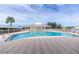 Inviting community pool with lounge chairs and a clubhouse at 25533 Heritage Lake Blvd # 19, Punta Gorda, FL 33983