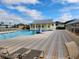 Relaxing community pool area with plenty of lounge chairs at 25533 Heritage Lake Blvd # 19, Punta Gorda, FL 33983