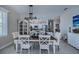 Farmhouse style dining room with white table and chandelier at 25533 Heritage Lake Blvd # 19, Punta Gorda, FL 33983