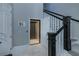 Elegant entryway with modern home elevator and staircase at 25533 Heritage Lake Blvd # 19, Punta Gorda, FL 33983