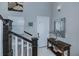 Bright and airy entryway with elegant staircase and console table at 25533 Heritage Lake Blvd # 19, Punta Gorda, FL 33983