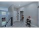 Upstairs hallway with light wood floors and access to bedrooms at 25533 Heritage Lake Blvd # 19, Punta Gorda, FL 33983