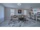 Open concept living and dining area with light floors and large windows at 25533 Heritage Lake Blvd # 19, Punta Gorda, FL 33983